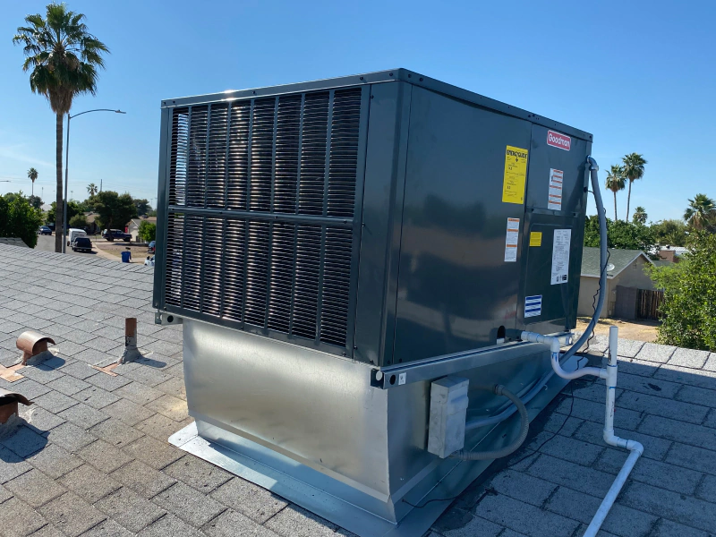 hvac unit installed on a residential house roof